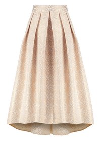 Jupe midi beige taille haute avec motif à pois dorés, plis creux et ourlet légèrement asymétrique.