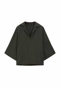 Blouse vert foncé à manches courtes avec col, présentant un décolleté en V et une coupe ample et carrée. Fabriquée dans un tissu lisse et léger.
