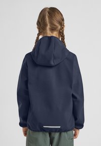 Navy blue waterproof jacket with a hood, smooth texture, elastic cuffs, and reflective accent at the back, worn by a child with braided hair.