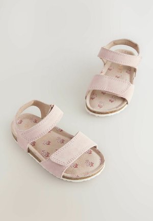 Heledad roosad sandaalid kahe reguleeritava rihmaga, pehmest nahast, lillemustriga sisetald ja struktureeritud valge kummist tallaga.