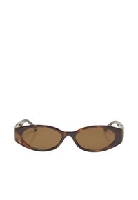 Lunettes de soleil ovales fines avec monture en écaille de tortue et verres teintés marron montrées sur un fond blanc.