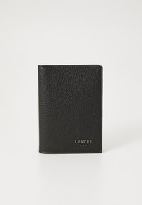 Black leather wallet with a textured surface, featuring a vertical design and embossed "LANCEL PARIS" logo at the bottom front.