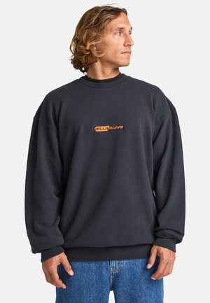Sudadera azul marino hecha de una mezcla de algodón, con un cuello redondo, hombros caídos y un logo bordado en naranja en el pecho.