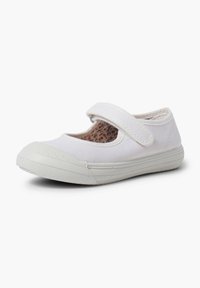 Chaussure Mary Jane blanche en toile avec une sangle Velcro. Elle dispose d'une semelle en caoutchouc et d'une doublure intérieure à motif floral. Design à bout rond.