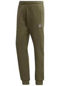 Olivgröna sweatpants av mjukt tyg med ribbad midja och muddar, med en liten vit Adidas-logotyp på vänster ben.