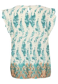 Blouse crème avec des motifs floraux turquoise, manches courtes à volants, fermeture à boutons à l'arrière du col, et un design orné au niveau de l'ourlet.