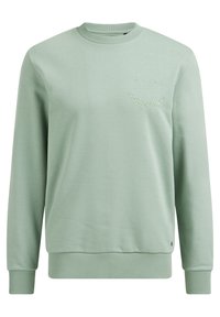 Světlě zelený sweatshirt s kulatým výstřihem a dlouhými rukávy, na kterém je vyšito "ŽÁDNÉ STÍŽNOSTI" v zakřiveném vzoru na horní levé části hrudi.