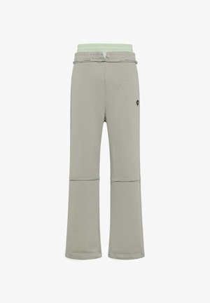 Hellgraue Lounge-Hose mit einem elastischen Bund in Minzgrün, gerade geschnittene Beine und ein kleines schwarzes Logo an der Seite.