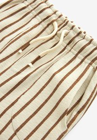 Next REGULAR FIT - Treniņtērpa apakšdaļas - ecru cream brown