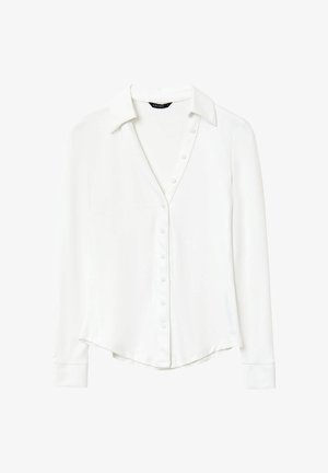 Camicia bianca a maniche lunghe con colletto a punta, chiusura con bottoni e orlo curvo. Realizzata in tessuto morbido con una leggera lucentezza.