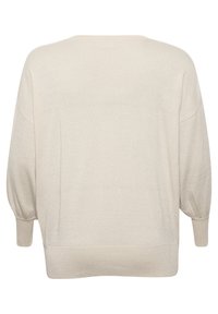 Kremowy, oversize sweter, dzianinowa tekstura, opadające ramiona, długie bufiaste rękawy, ribbowe mankiety i dół, minimalny połysk. Widok z tyłu.
