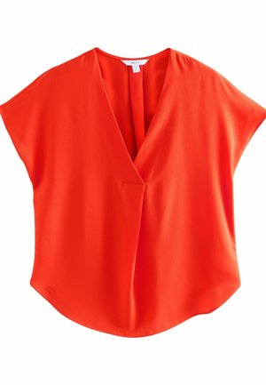 Jasno pomarańczowa bluzka z krótkim rękawem, dekoltem w serek i luźnym krojem, wykonana z gładkiej tkaniny, z metką „NEXT” przy kołnierzu.