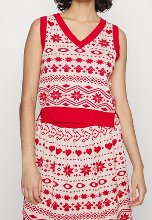 Haut sans manches en tricot rouge et blanc avec col en V, arborant des motifs festifs de cœurs, étoiles, yeux et champignons, assorti à une jupe.
