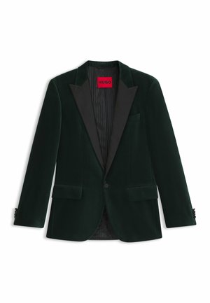 Dunkelgrüner Samt-Ein-Knopf-Blazer mit schwarzen Satin-Revers, Pattentaschen und einem roten "HUGO"-Etikett im Krageninneren.