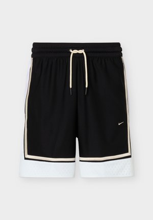 Zwarte sportshorts met witte mesh boorden, beige randafwerking, elastische tailleband en witte trekkoorden, met een klein Nike swoosh-logo.