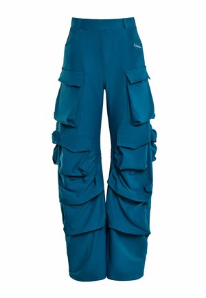 Teal cargo pants made of soft fabric with multiple large pockets, adjustable side gathers, and a fitted waistband.