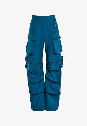 Teal-huono cargo-housut, jotka on valmistettu pehmeästä kankaasta, joissa on useita suuria taskuja, säädettävät sivukoostumukset ja istuva vyötärö.