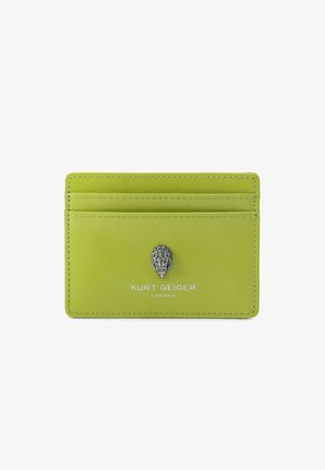 Green leather cardholder featuring silver hardware, embossed logo, and four card slots. Smooth texture with contrast stitching.