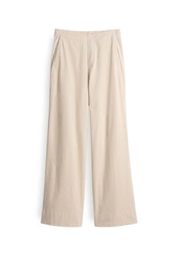 Pantalon beige à jambes larges avec ceinture élastique et poches latérales, en tissu doux et texturé.