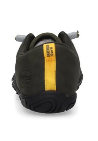 Dark green shoe with a yellow accent strip, rounded design, rubber sole, textured back, and gray lacing hardware.
