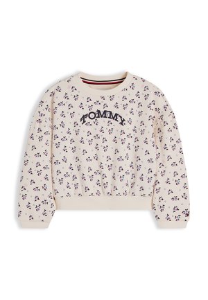 Krem sweatshirt med lille lyserødt og sort blomsterprint, "TOMMY" tekst på brystet, ribstrikkede ærme- og bundkanter samt rund hals.