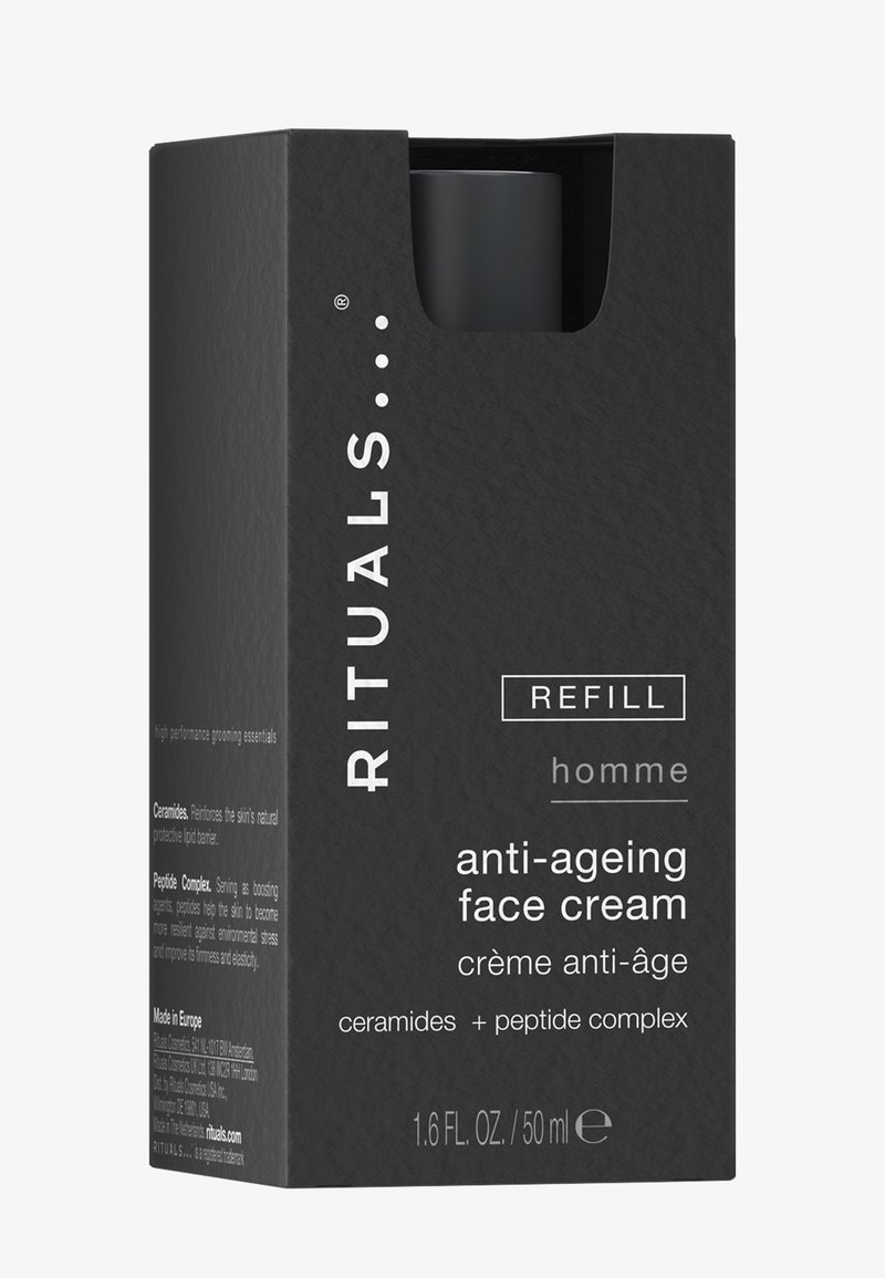 Svart refill-boks med Rituals homme anti-aldrende ansiktskrem med ceramider og peptidkompleks, 50 ml, delvis åpen topp.