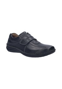 Zwarte leren schoen met een ronde neus, twee verstelbare banden en zichtbare stikselaccenten. Lichtgewicht zool voor comfort.