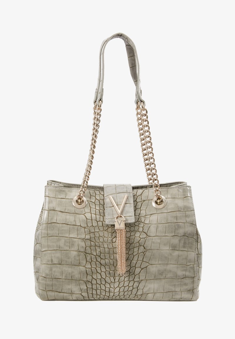 Gray faux-crocodile handbag with gold chain straps. Features a front flap with a metal accent and a decorative tassel detail.