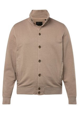 Beige jakke med opretstående krave, frontknaplukning og to sidelommer. Lavet af et glat stof, har ribbede manchetter og søm.