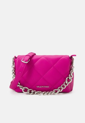 Bright pink quilted leather Valentino shoulder bag with silver chain and adjustable strap on plain background.