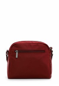 Red nylon crossbody bag with a zip closure, front pocket, and adjustable strap. Smooth texture and rounded shape. Silver hardware accent.