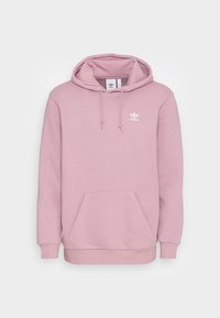 Růžová mikina s kapucí z měkké bavlněné směsi. Má přední kapsu na doplňky, žebrované manžety a bílý nápis na hrudi.