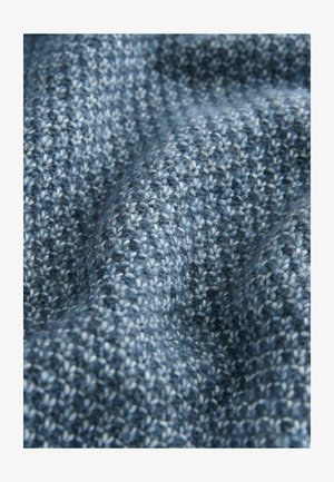 Gebreide stof in verschillende tinten blauw met een gestructureerd patroon. Zacht, warm uiterlijk met een iets fluweelachtige oppervlakte.