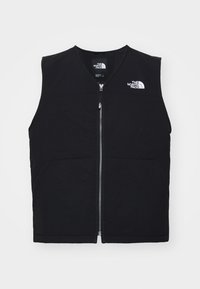 Chaleco negro sin mangas con cremallera frontal, hecho de tela suave. Cuenta con dos bolsillos laterales y el logo "The North Face" en la parte superior izquierda.