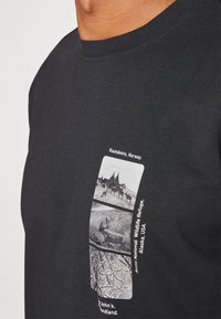Adidas Terrex NATIONAL GEOGRAPHIC UNITEFIT GFX TEE LS - Tops ar garām piedurknēm - black