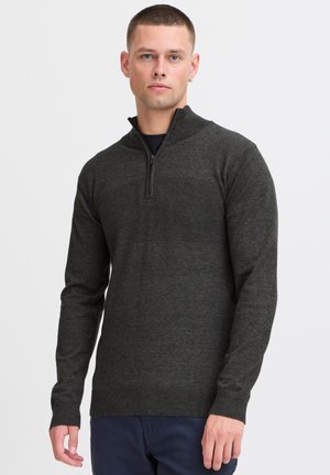 Dark gray pullover sweater with a quarter-zip collar, long sleeves, and a textured band across the chest. Made of knit material.