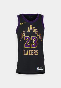 Čierny basketbalový dres s žltým a fialovým textom, ktorý uvádza "LOS ANGELES" a "LAKERS", s číslom "23" v tučnom písmene. Logo Nike na pleci.