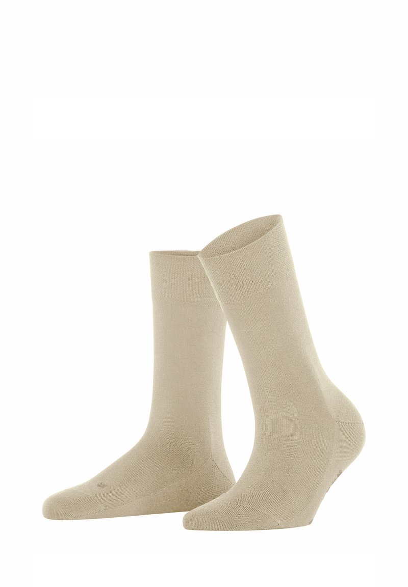 Beige Baumwollsocken mit glatter Textur, in mittellanger Knöchellänge und verstärktem Zehen- und Fersenbereich. Einfaches Design ohne sichtbare Muster oder Akzente.