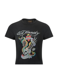 Musta puuvillapaita, jossa on värikäs graafinen suunnittelu, jossa on pääkallo, kotka, sydän ja käärmeitä, merkitty "Ed Hardy New York City."