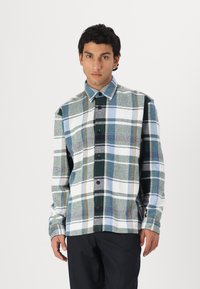 Plaid shirt in blue, green, and white hues, featuring a button-up design, collar, and long sleeves. Textured fabric with contrasting accents.