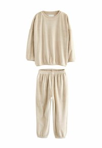 Beige ribbed lounge set, featuring a long-sleeve top with elastic hem and matching pants with elastic waistband and cuffs. Soft texture.