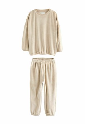 Beige geripptes Lounge-Set, bestehend aus einem Langarmoberteil mit elastischem Saum und passenden Hosen mit elastischem Bund und Bündchen. Weiche Textur.