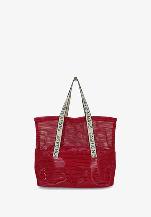 Rode net boodschappentas met brede, roomkleurige handvatten bedrukt met "FASHION BAGS" in zwarte tekst.