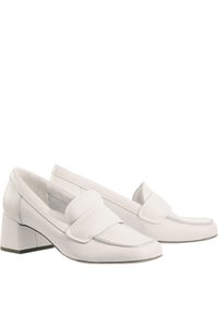 White leather block-heeled loafers with a textured finish, featuring a rounded toe and a prominent strap across the instep.