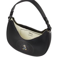 Black leather shoulder bag with a curved shape, featuring a perforated design and a cartoon character. Silver zipper and cream interior.