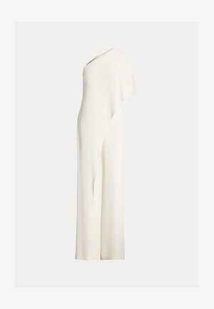 Asymmetriska one-shoulder jumpsuit i mjukt vitt tyg. Har vida ben och en smidig fall. Minimalistisk design utan synlig hårdvara.