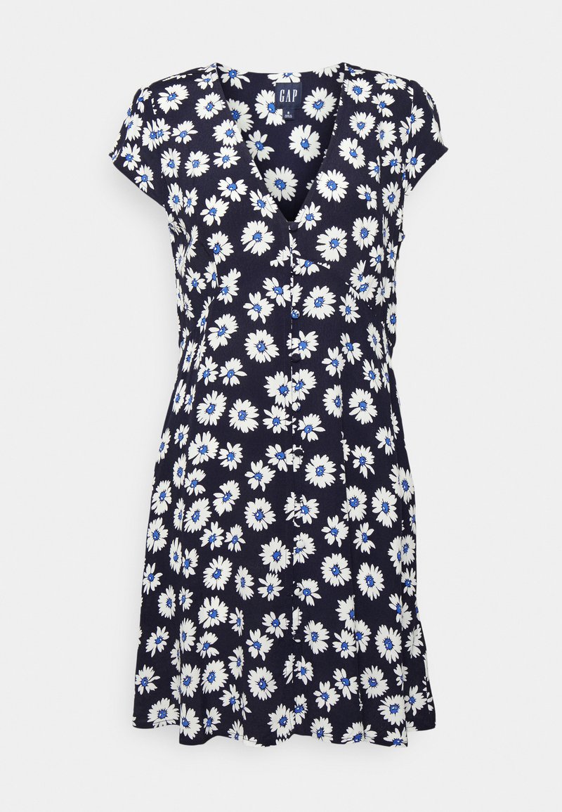 Vestido de marinha com padrão floral em branco e azul, decote em V, mangas curtas e detalhes em botão na parte da frente. Tecido leve com forma em A.