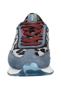 Blue suede sneaker with leopard print textile, red laces, and black accents. Translucent light blue sole with a camo pattern detail.