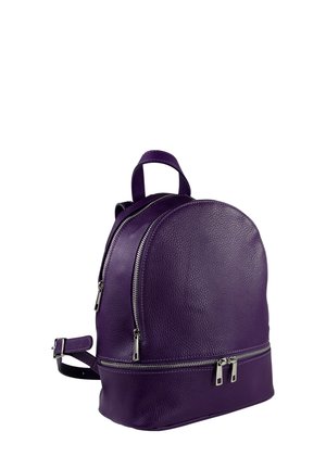 Purple leather backpack with a rounded shape, dual zip compartments, and adjustable straps. Textured surface with metallic hardware accents.