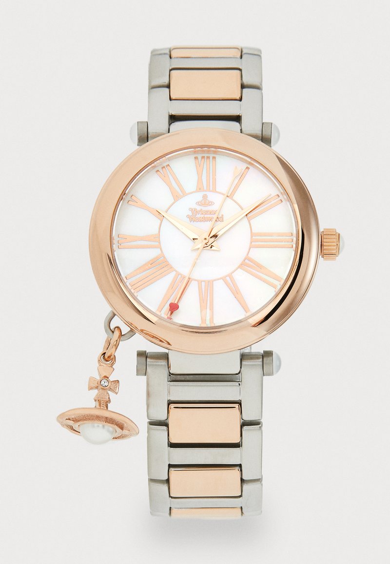 Rose gold and silver metal watch with a round face, white mother-of-pearl dial, Roman numerals, and a charm with a pearl and bow detail.